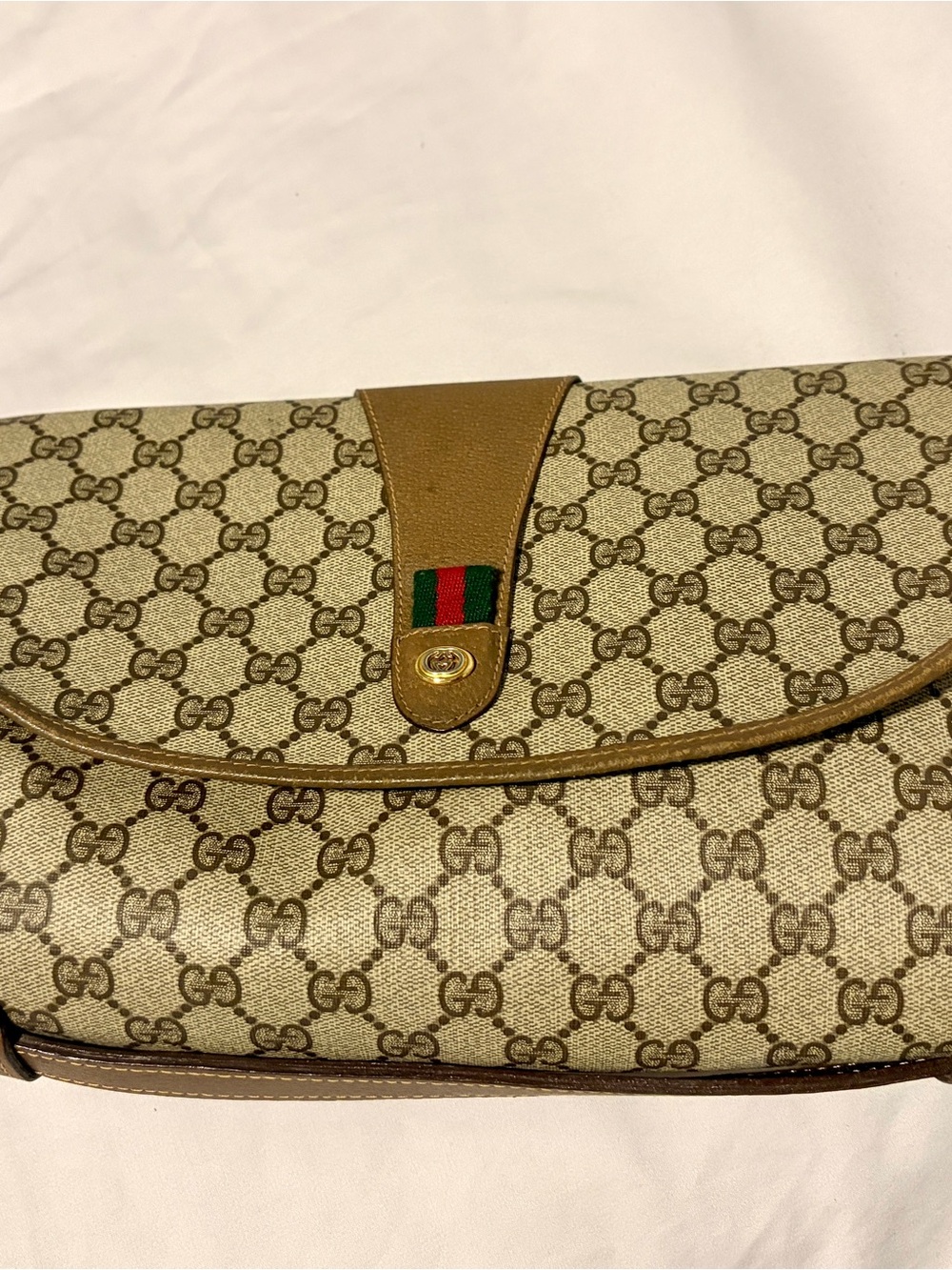 Gucci Beige GG Canvas Clutch with Brown Leather Trim.